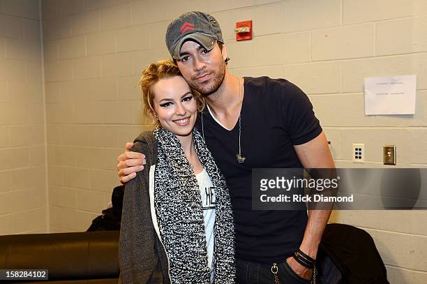 Bridgit Mendler and Enrique Iglesias pose backstage at Power 96.1's Jingle Ball 2012 at the Philips Arena on December 12, 2012 in Atlanta.