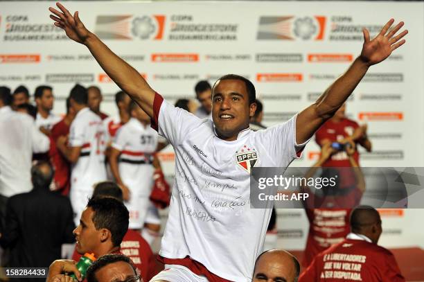 Lucas of Brazil's Sao Paulo celebrates after winning the 2012 Copa Sudamericana final football match against Argentina’s Tigre in the Morumbi...