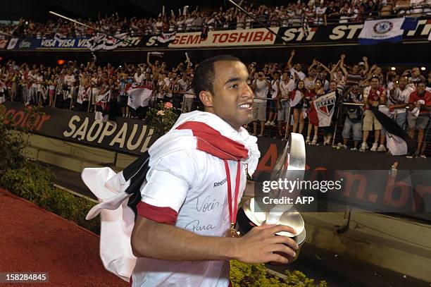 Lucas of Brazil's Sao Paulo runs for the fans after the victory of their Copa Sudamericana football final match against Argentine's Tigre at Morumbi...