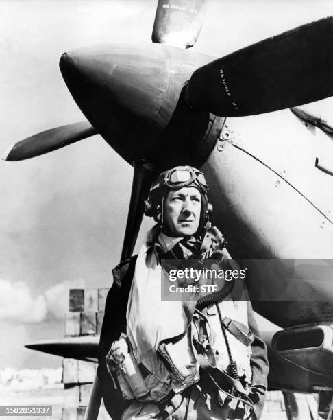 Picture taken 12 January 1953 at the Pinewood Studios, near London, of British actor Alec Guinness standing in flying kit for his starring part as a...