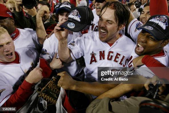 Erstad, Spiezio and Ochoa celebrate winning the World Series Erstad, Spiezio and Ochoa celebrate winning the World Series