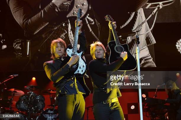 Richie Sambora and Jon Bon Jovi perform at "12-12-12" a concert benefiting The Robin Hood Relief Fund to aid the victims of Hurricane Sandy presented...
