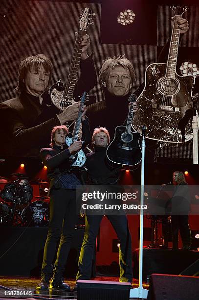 Richie Sambora and Jon Bon Jovi perform at "12-12-12" a concert benefiting The Robin Hood Relief Fund to aid the victims of Hurricane Sandy presented...