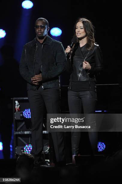 Sean 'Diddy' Combs and actress Olivia Wilde speak onstage at "12-12-12" a concert benefiting The Robin Hood Relief Fund to aid the victims of...