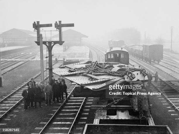 Ton rudder for the Cunard liner Aquitania, carried from Darlington by a special LNER train, joins the main line at Eaglescliffe railway station,...