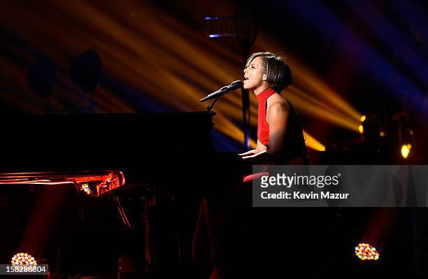 Alicia Keys performs at "12-12-12" a concert benefiting The Robin Hood Relief Fund to aid the victims of Hurricane Sandy presented by Clear Channel...