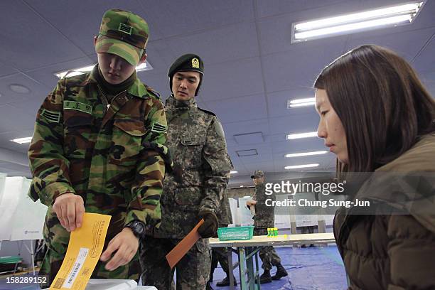 South Korean soldiers cast their absentee ballots for new President in a polling station on December 13, 2012 in Seoul, South Korea. South Koreans...