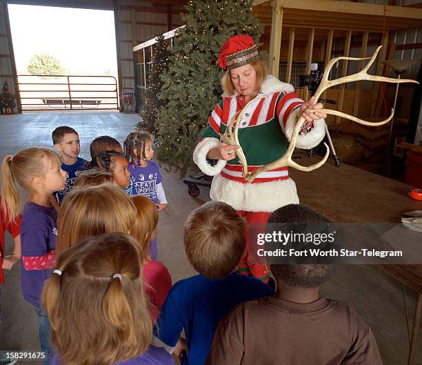 Roberta Smith talks with kids touring the Double R Reindeer Ranch in Midlothian, Texas, on December 4, 2012.