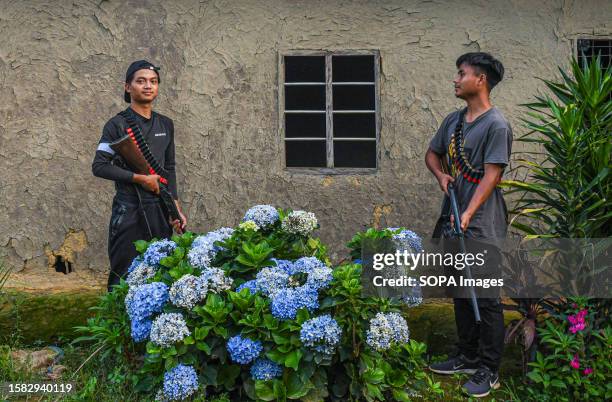 Armed youths from the Kuki tribe pose for a photo during their frontline operation in Churachandpur district in the northeastern state of Manipur....