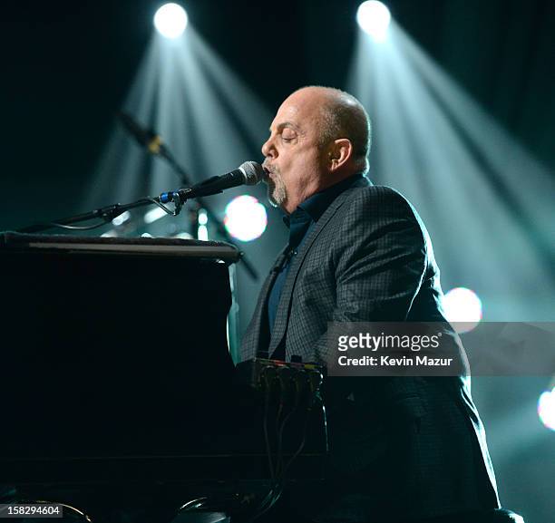 Billy Joel performs at "12-12-12" a concert benefiting The Robin Hood Relief Fund to aid the victims of Hurricane Sandy presented by Clear Channel...