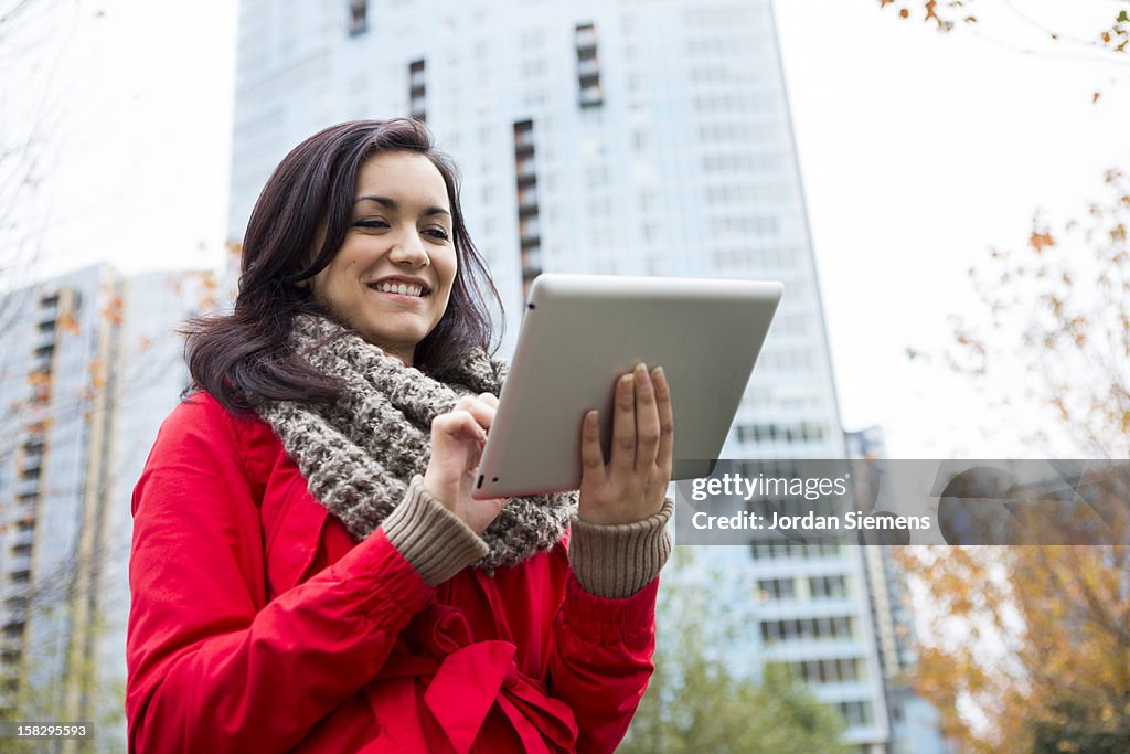 A woman using a digital tablet.