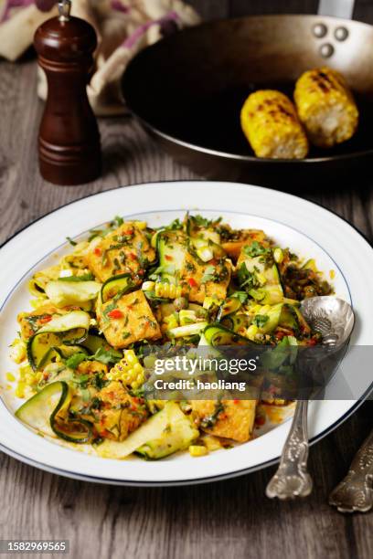 grilled sweet corn, courgette salad with fried tofu for vegan diet - fusion food stock pictures, royalty-free photos & images