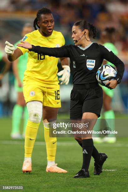 Nigeria goalkeeper Chiamaka Nnadozie protests as referee Melissa Borjas initially awards a penalty to England, which was later overturned by VAR...
