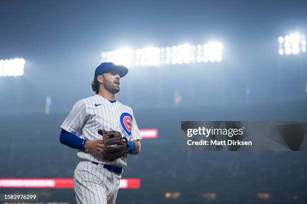 Dansby Swanson of the Chicago Cubs exits the field of play in a game against the Philadelphia Phillies at Wrigley Field on June 27, 2023 in Chicago,...