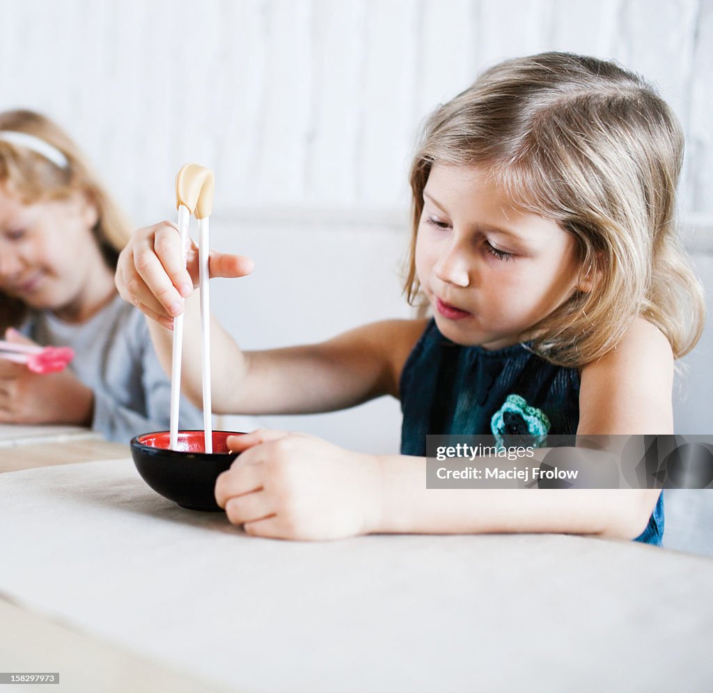 Children eating at a sushi-bar