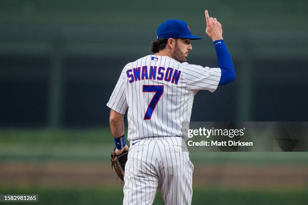 Dansby Swanson of the Chicago Cubs gestures for an out recorded in a game against the Philadelphia Phillies at Wrigley Field on June 27, 2023 in...