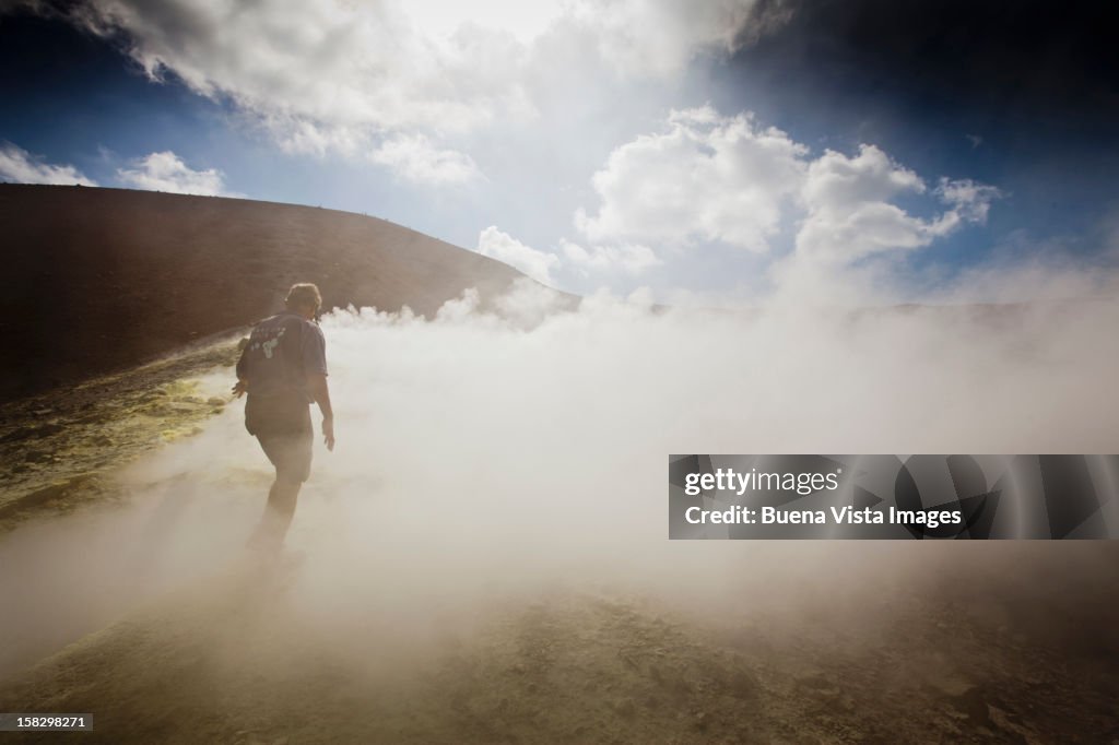 Man in sulphurous steam on a vulcano