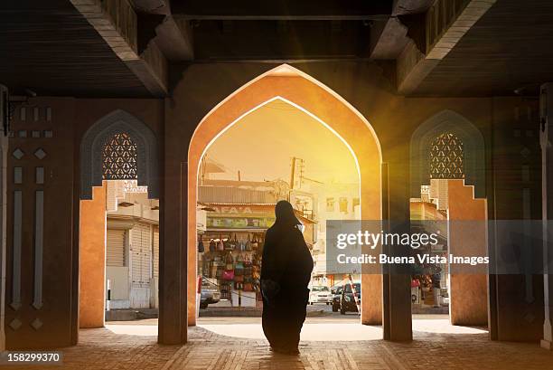 arab woman in a souk - people from oman stockfoto's en -beelden