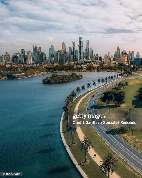 aerial panorama of melbourne from albert park. - melbourne skyline stock pictures, royalty-free photos & images