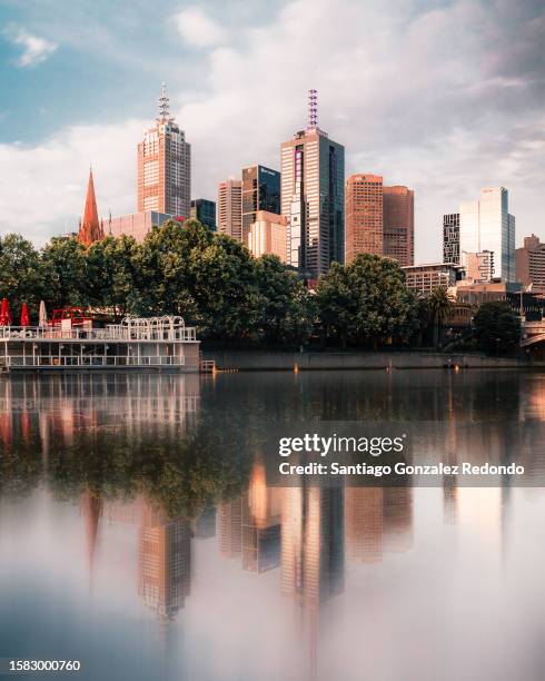 a postcard of melbourne's skyline by the yarra river. - melbourne racing stock pictures, royalty-free photos & images