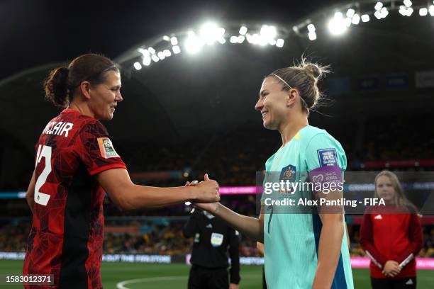 Steph Catley of Australia shakes hands with Christine Sinclair of Canada before the coin toss prior to kick off during the FIFA Women's World Cup...