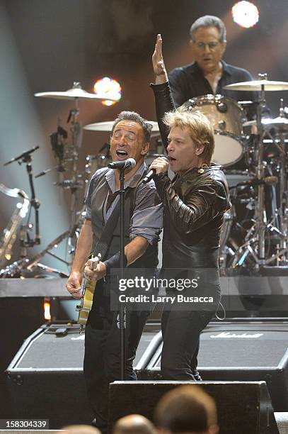 Bruce Springsteen and Jon Bon Jovi perform during "12-12-12" a concert benefiting The Robin Hood Relief Fund to aid the victims of Hurricane Sandy...