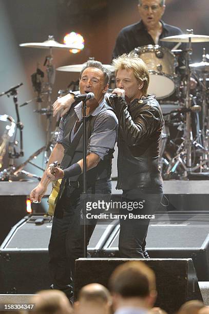 Bruce Springsteen and Jon Bon Jovi perform during "12-12-12" a concert benefiting The Robin Hood Relief Fund to aid the victims of Hurricane Sandy...