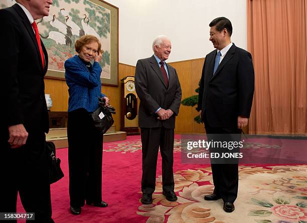 Communist Party leader Xi Jinping talks with former US president Jimmy Carter and his wife Rosilyn in room 202 of the Zhongnanhai leadership compound...
