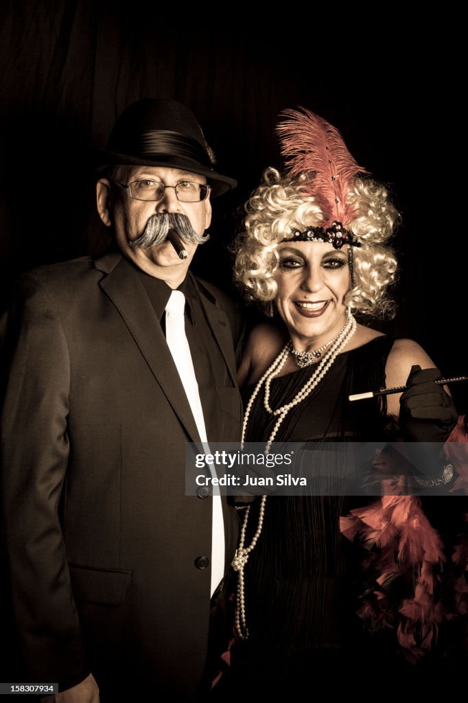 Couple wearing 1920s costumes in a party