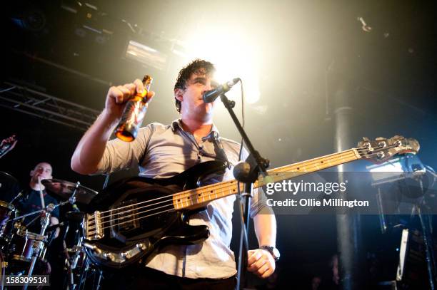 Chris Batten of Enter Shikari Performs onstage showing off the bands beer during a day of the 5th UK leg of their A Flash Flood of Colour World Tour...