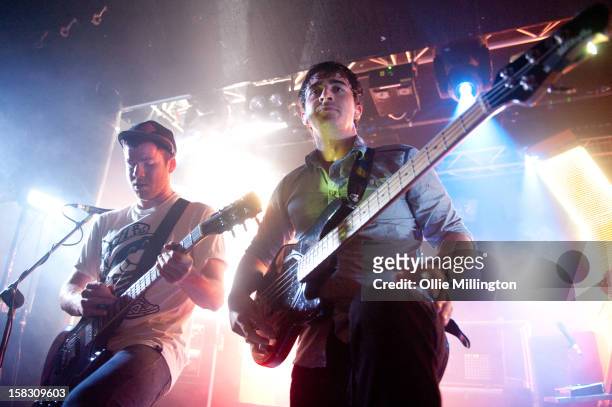 Liam "Rory" Clewlow and Chris Batten of Enter Shikari Perform onstage during a day of the 5th UK leg of their A Flash Flood of Colour World Tour...