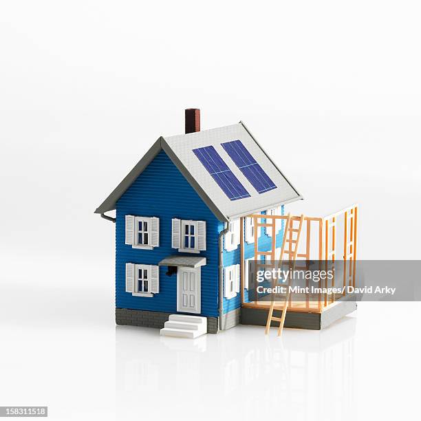 a model of a traditional house, with terrace or framework of an extension. - home exterior stock illustrations