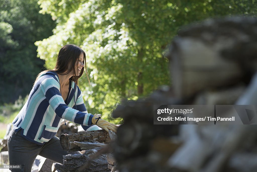 A young woman with long black hair, outdoors in the fresh air.