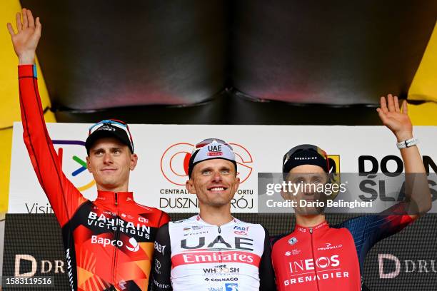 Matej Mohorič of Slovenia and Team Bahrain - Victorious on second place, stage winner Rafał Majka of Poland and UAE Team Emirates and Michał...