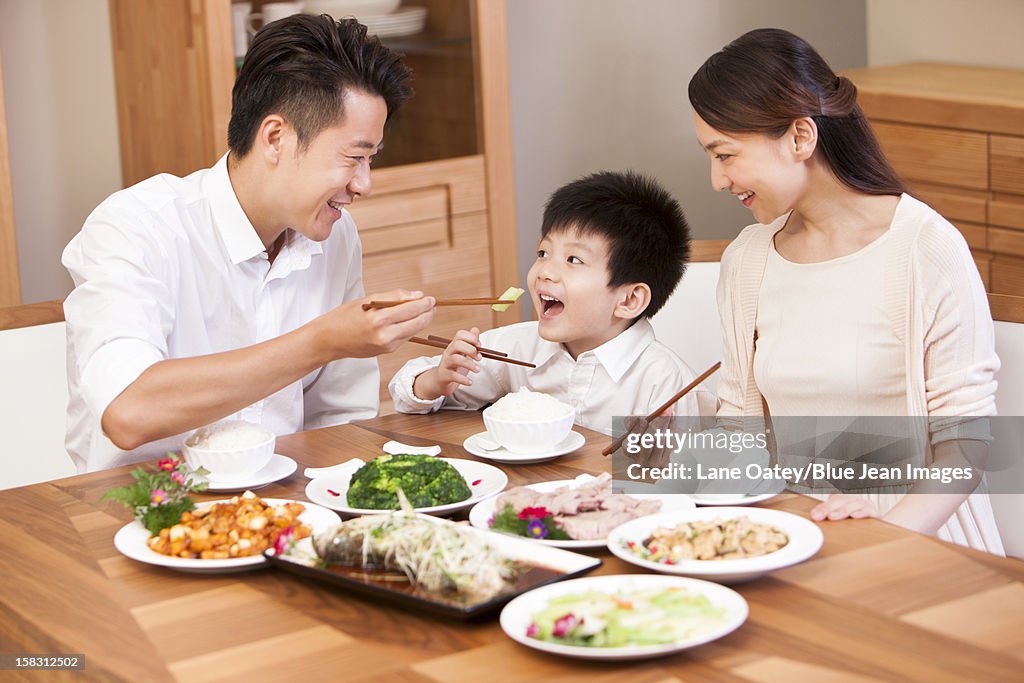 Happy family enjoying meal time