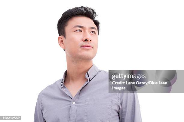 portrait of young man looking at view - portrait white background looking away stockfoto's en -beelden
