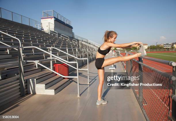 caucasian runner stretching before exercise - girl who stands stock pictures, royalty-free photos & images