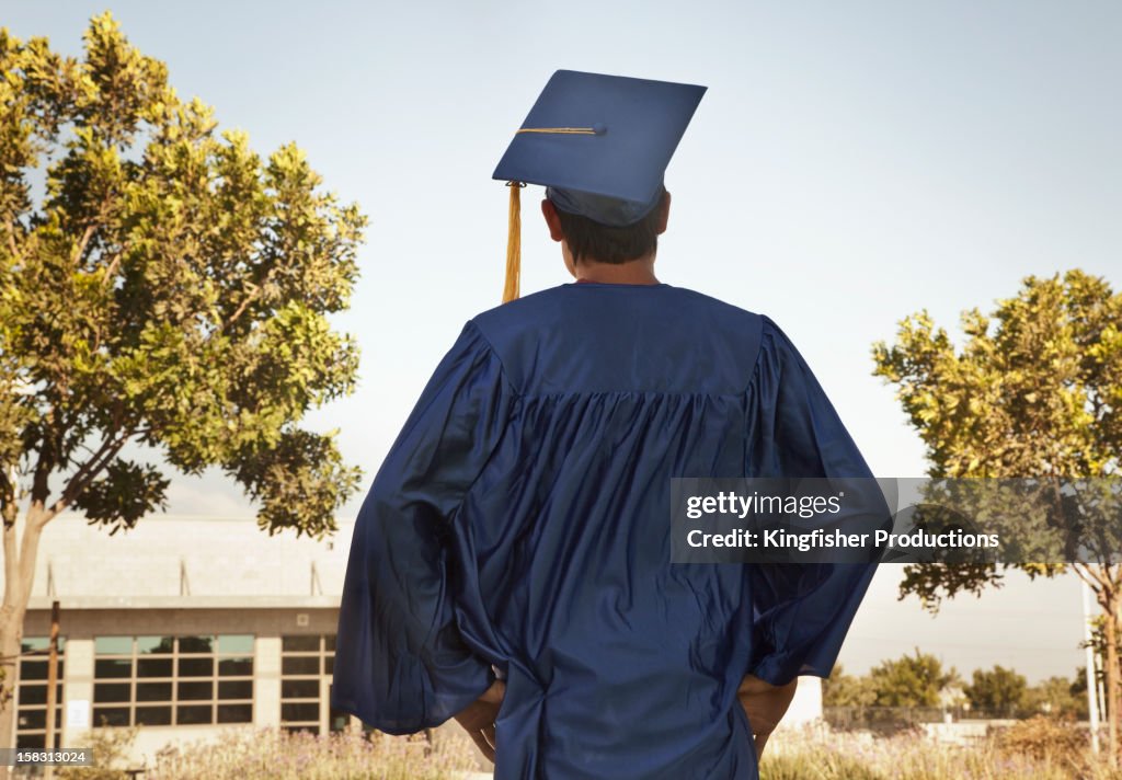 Rear view of graduate in cap and gown