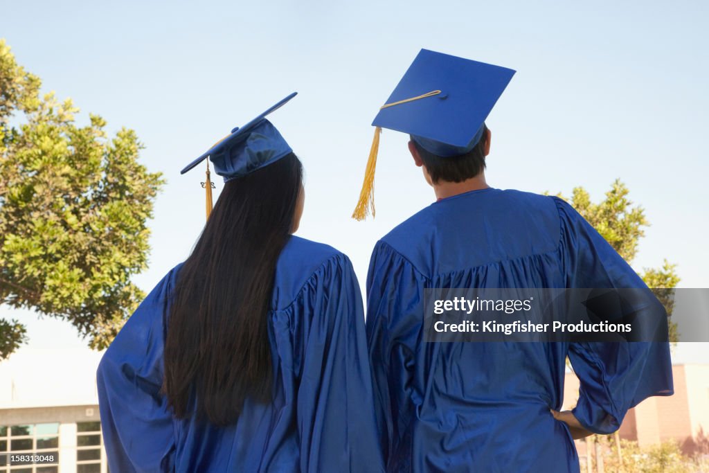 Graduate Def Graduates In Caps And Gowns High-Res Stock Photo - Getty Images