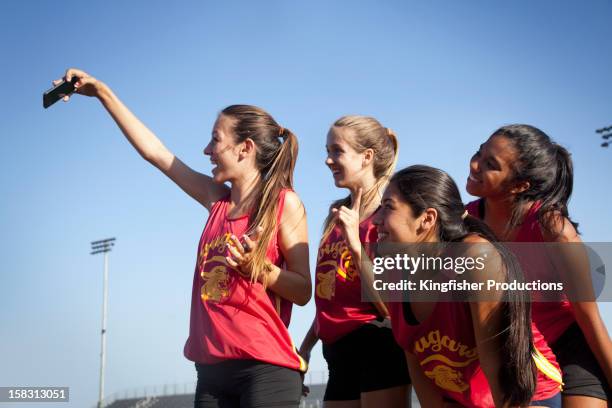 teenage runners taking self-portrait - young athletes stock pictures, royalty-free photos & images