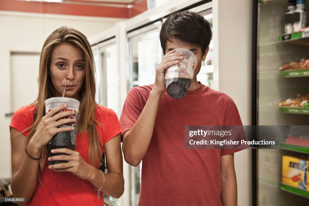 Couple drinking soda