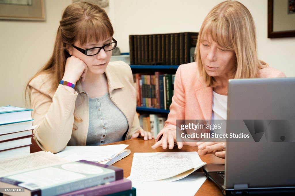 Teacher talking with student