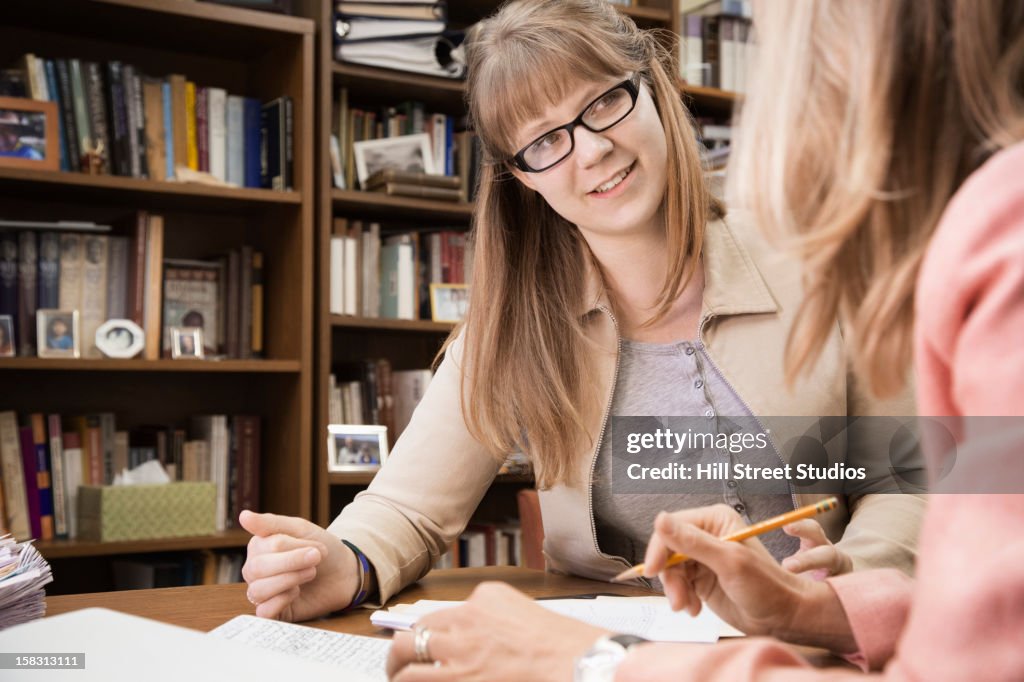 Teacher talking with student