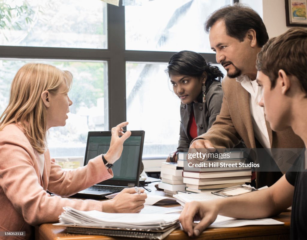 Teacher talking with co-workers