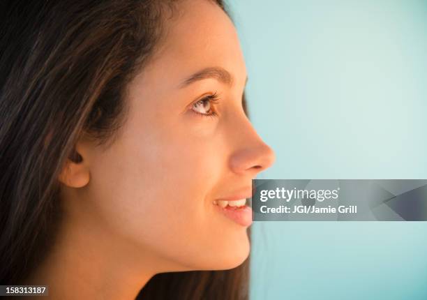 smiling hispanic teenager - hispanic man profile hopeful stock-fotos und bilder