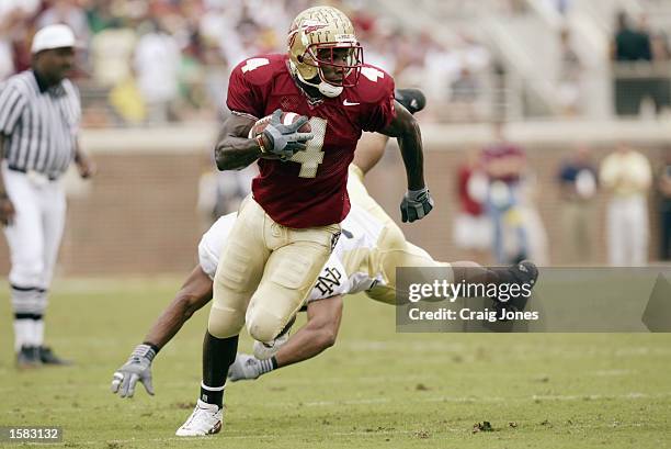 Anquan Boldin of the Florida State Seminoles is chased by Courtney Watson of the Notre Dame Fighting Irish at Doak Campbell Stadium on October 26,...