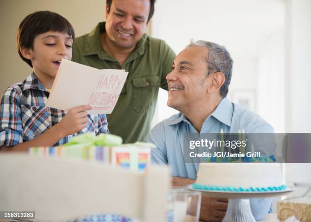 hispanic grandfather, father and son celebrating birthday - puerto rican people stock pictures, royalty-free photos & images