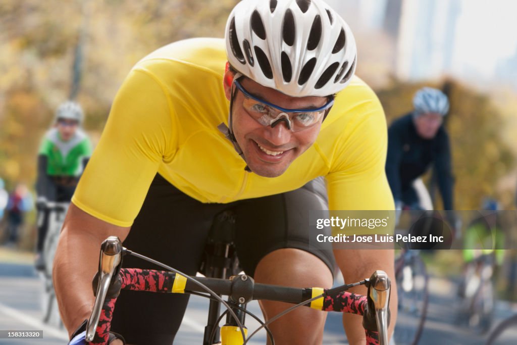 Mixed race man in bicycle race