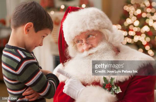 santa lecturing caucasian boy - naughty santa 個照片及圖片檔