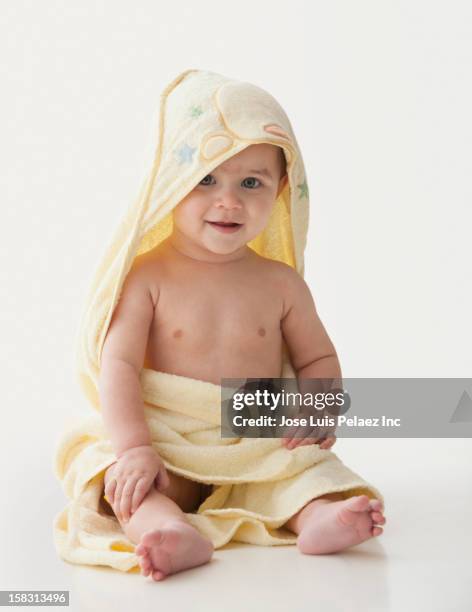 hispanic baby wrapped in towel - wrapped in a towel stock pictures, royalty-free photos & images
